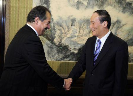 Chinese&nbsp;Vice&nbsp;Premier&nbsp;Wang&nbsp;Qishan&nbsp;(R)&nbsp;meets&nbsp;with&nbsp;a&nbsp;delegation&nbsp;from&nbsp;the&nbsp;U.S.-China&nbsp;Business&nbsp;Council,&nbsp;led&nbsp;by&nbsp;Chairman&nbsp;Andrew&nbsp;Liveris&nbsp;(L),&nbsp;who&nbsp;is&nbsp;also&nbsp;chairman&nbsp;and&nbsp;chief&nbsp;executive&nbsp;officer&nbsp;of&nbsp;the&nbsp;Dow&nbsp;Chemical&nbsp;Company,&nbsp;in&nbsp;Beijing,&nbsp;capital&nbsp;of&nbsp;China,&nbsp;Nov.&nbsp;4,&nbsp;2009.&nbsp;(Xinhua/Zhang&nbsp;Duo)