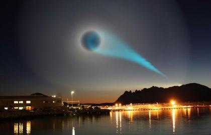 An eerie turquoise light spotted over Norway sparked a mystery, with suggestions it could be a missile test. The light was photographed by Jan Petter Jorgensen while he was on his way to work at a salmon factory