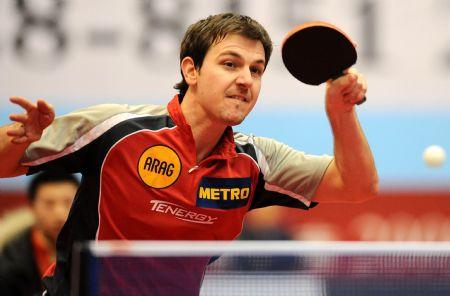 Shakehand player, Germany's Timo Boll returns a shot against China's Ma Lin, a Penhold player, during a table tennis charity competition between the Shakehand team and the Penhold team in Chengdu, capital of Southwest China's Sichuan Province, Jan. 14, 2010. (Xinhua/Chen Kai)