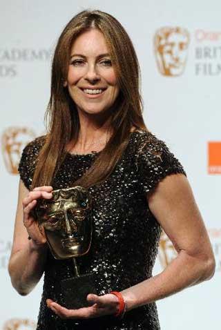 US director Kathryn Bigelow poses for photographers with her British Academy of Film Award (BAFTA) for 'Director' for 'The Hurt Locker' at the Royal Opera House in central London. Bigelow scooped the best film BAFTA for her Iraq war movie 