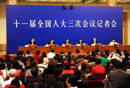 Zhang Ping, Chairman of National Development and Reform Commission (NDRC), Xie Xuren, the Minister of Finance, Chen Deming, the Minister of Commerce, and Zhou Xiaochuan, governor of the People's Bank of China, attend a news conference of the Third Session of the 11th National People's Congress (NPC) on the enhancement and improvement of macro-economic control held at the Great Hall of the People in Beijing, China, March 6, 2010. (Xinhua/Li Ziheng)