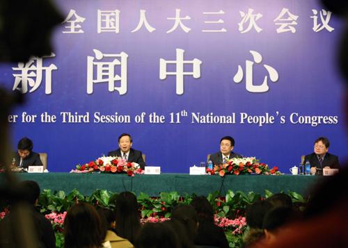 Officials from the People's Bank of China and the State Administration of Foreign Exchange attend a press conference on foreign exchange control and foreign exchange reserve held on the sidelines of the Third Session of the 11th National People's Congress in Beijing, China, March 9, 2010. (Xinhua/Yuan Man)
