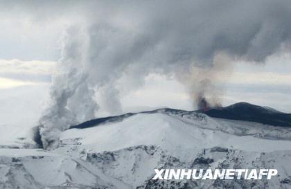 The Eyjafjallajokull volcano erupts in southern Iceland early March 21, 2010.  The volcano erupted overnight, forcing hundreds of people to evacuate the area and diverting flights after authorities declared a local state of emergency.  (Xinhua/AFP Photo)