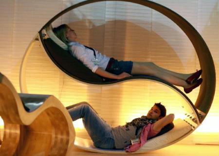 Visitors lie on a furniture design during the 49th Milan furniture & design week in Milan, Italy, April 18, 2010. The six-day Milan furniture & design week was concluded on Monday, April 19. (Xinhua/Huang Xiaozhe) 