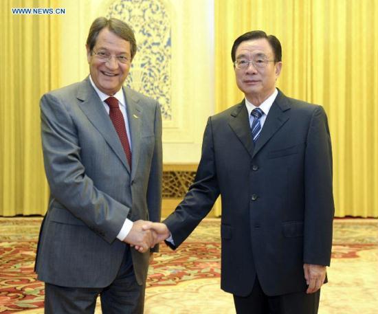 He Guoqiang(R), a member of the Standing Committee of the Political Bureau of the Central Committee of the Communist Party of China (CPC) and chief of the CPC Central Commission for Discipline Inspection, meets with Nikos Anastasiades, president of Cyprus' ruling Democratic Rally party. (Xinhua/Zhang Duo) <br><br>
