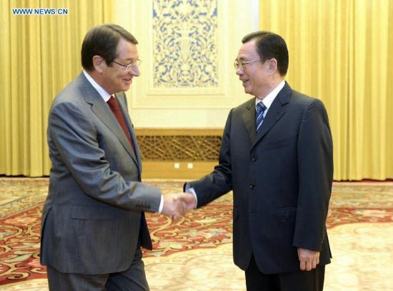 He Guoqiang (R), a member of the Standing Committee of the Political Bureau of the Central Committee of the Communist Party of China (CPC) and chief of the CPC Central Commission for Discipline Inspection, meets with Nikos Anastasiades, president of Cyprus' ruling Democratic Rally party. (Xinhua/Zhang Duo) <br>