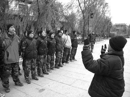 11-year-old&nbsp;Wang&nbsp;Wei,&nbsp;the&nbsp;youngest,&nbsp;leads&nbsp;the&nbsp;group&nbsp;in&nbsp;singing&nbsp;military&nbsp;songs&nbsp;before&nbsp;meals.