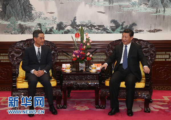 12月26日，国家主席习近平在中南海会见来北京述职的香港特别行政区行政长官梁振英。新华社记者 庞兴雷 摄