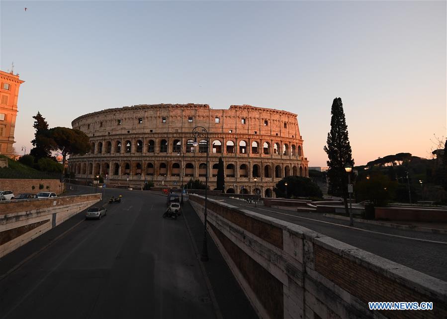 Vehicles are seen near the Colosseum in Rome, Italy, on April 3, 2020. To date, the COVID-19 pandemic has claimed 14,681 lives in locked-down Italy. The number of confirmed infections, fatalities and recoveries totaled 119,827 on Friday, the country