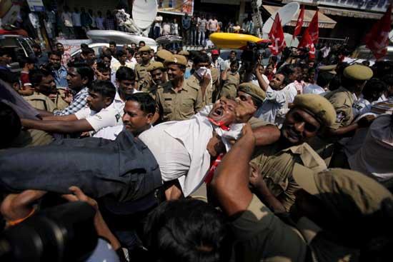 Indian policemen detain activists of left parties during a nationwide strike in Hyderabad, India, Thursday, Sept. 20, 2012.