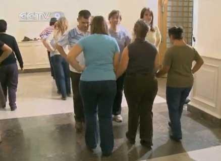 A group of people with mental disabilities learning traditional Irish step dancing.
