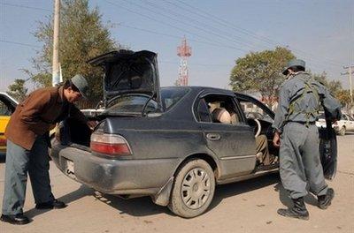 Afghan&nbsp;policemen&nbsp;search&nbsp;a&nbsp;vehicle&nbsp;at&nbsp;a&nbsp;checkpoint&nbsp;in&nbsp;Kabul&nbsp;in&nbsp;October&nbsp;2009.&nbsp;Afghan&nbsp;and&nbsp;international&nbsp;authorities&nbsp;have&nbsp;ordered&nbsp;a&nbsp;security&nbsp;lockdown&nbsp;on&nbsp;Kabul&nbsp;to&nbsp;stop&nbsp;Taliban&nbsp;attacks&nbsp;marring&nbsp;Thursday's&nbsp;inauguration&nbsp;of&nbsp;President&nbsp;Hamid&nbsp;Karzai&nbsp;for&nbsp;another&nbsp;five&nbsp;years&nbsp;in&nbsp;power.&nbsp;(AFP/File/Shah&nbsp;Marai)
