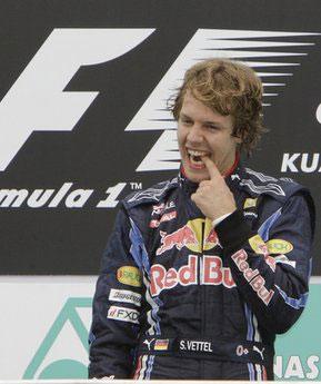 Red Bull driver Sebastian Vettel of Germany celebrates on his car