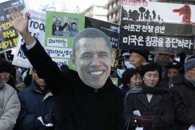 An&nbsp;anti-war&nbsp;activist&nbsp;wearing&nbsp;a&nbsp;mask&nbsp;of&nbsp;U.S.&nbsp;President&nbsp;Barack&nbsp;Obama&nbsp;performs&nbsp;before&nbsp;he&nbsp;receives&nbsp;a&nbsp;Nobel&nbsp;War&nbsp;Prize&nbsp;during&nbsp;a&nbsp;rally&nbsp;near&nbsp;the&nbsp;U.S.&nbsp;embassy&nbsp;in&nbsp;Seoul&nbsp;November&nbsp;18,&nbsp;2009.&nbsp;About&nbsp;40&nbsp;protesters&nbsp;rallied&nbsp;in&nbsp;Seoul&nbsp;on&nbsp;Wednesday&nbsp;to&nbsp;demand&nbsp;the&nbsp;U.S.-North&nbsp;Korea&nbsp;Summit&nbsp;for&nbsp;making&nbsp;a&nbsp;peace&nbsp;treaty&nbsp;in&nbsp;the&nbsp;Korean&nbsp;Peninsula&nbsp;and&nbsp;to&nbsp;denounce&nbsp;the&nbsp;South&nbsp;Korean&nbsp;government's&nbsp;decision&nbsp;to&nbsp;send&nbsp;its&nbsp;troops&nbsp;to&nbsp;Afghanistan&nbsp;again,&nbsp;ahead&nbsp;of&nbsp;U.S.&nbsp;President&nbsp;Barack&nbsp;Obama's&nbsp;visit.&nbsp;The&nbsp;right&nbsp;black&nbsp;banner&nbsp;reads,&nbsp;