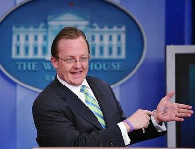 White House Press Secretary Robert Gibbs jokingly refers to a list written on his hand during a briefing in the Brady Briefing Room of the White House in Washington, DC. (AFP/Mandel Ngan)