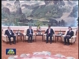 习近平会见国际奥委会主席并接受奥林匹克金质勋章