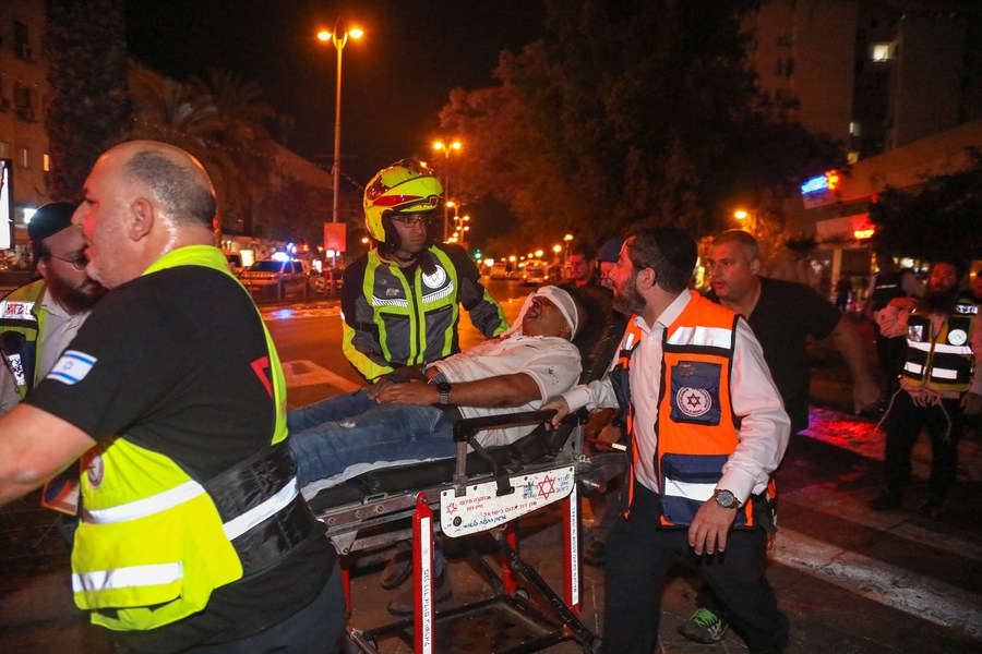An Israeli injured by a rocket fired from the Gaza strip is evacuated in central Israeli city of Holon, on May 11, 2021. 