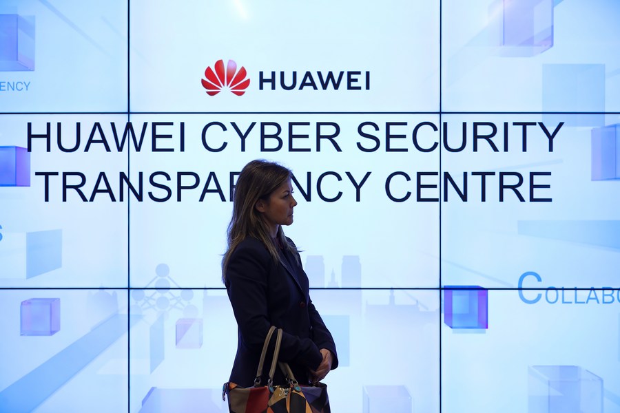 A woman listens to a debate at Huawei Cyber Security Transparency Centre in Brussels, Belgium, Jan. 30, 2020. (Xinhua/Zhang Cheng)