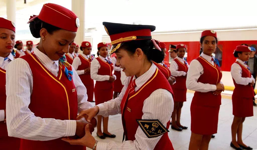 A Chinese conductor trains the Ethiopian attendants at a railway station in suburban Addis Ababa, Ethiopia, Oct. 1, 2016. The Chinese-built railway linking the Ethiopian capital and the port of Djibouti is expected to help the landlocked African country improve access to the sea and speed up a burgeoning industrialization process. 