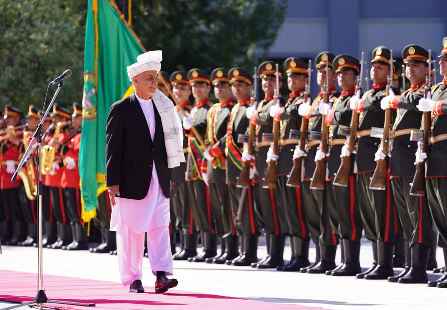 Afghan President Mohammad Ashraf Ghani inspects the guard of honor as he attends Eid al-Fitr prayers at Presidential Palace in Kabul, capital of Afghanistan, May 13, 2021.