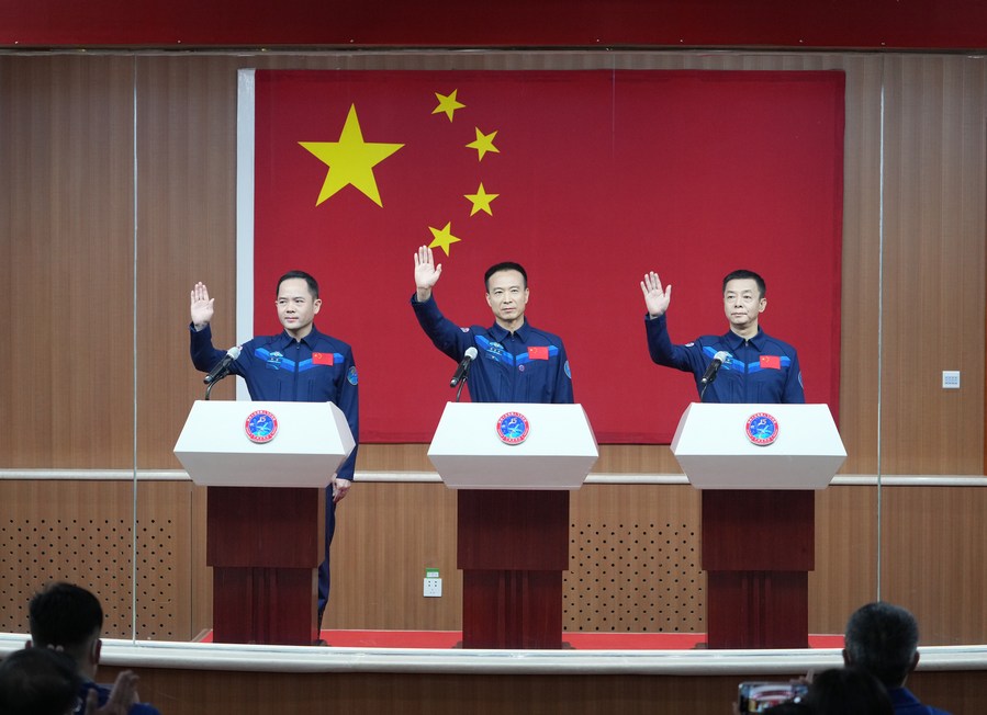 Fei Junlong (C), Deng Qingming (R) and Zhang Lu, the three Chinese taikonauts for the upcoming Shenzhou-15 mission, meet the press at the Jiuquan Satellite Launch Center in northwest China, Nov. 28, 2022. (Xinhua/Li Gang)