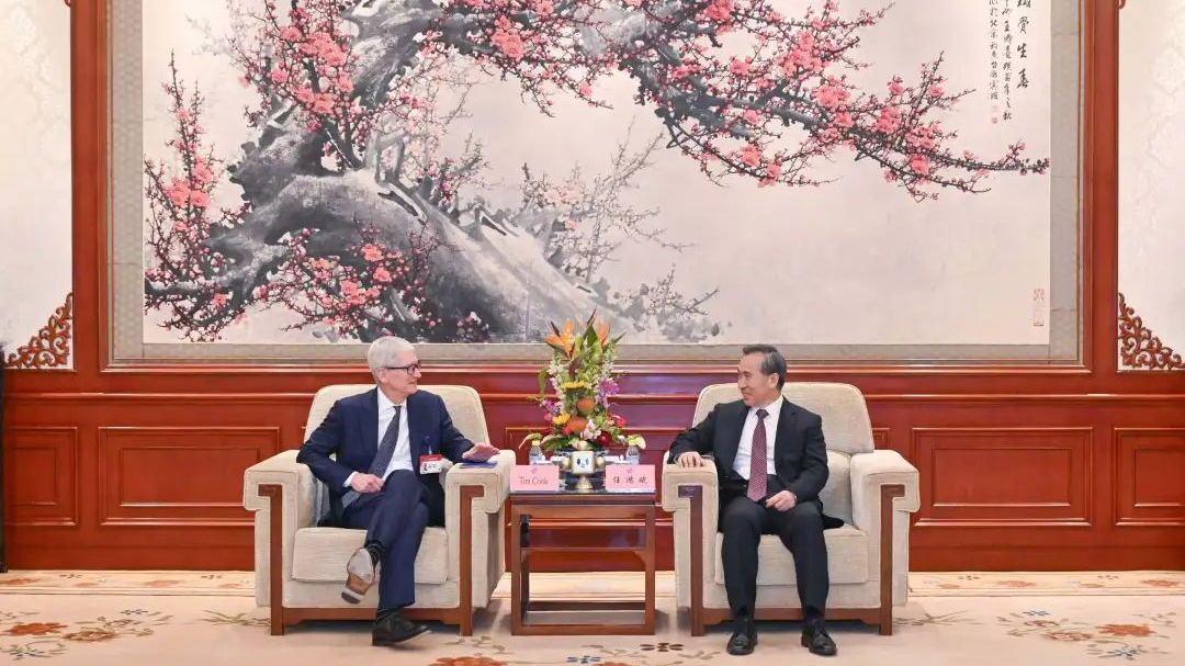 China Council for the Promotion of International Trade (CCPIT) Chairman Ren Hongbin meets with Tim Cook, CEO of Apple Inc., in Beijing, March 23, 2025.