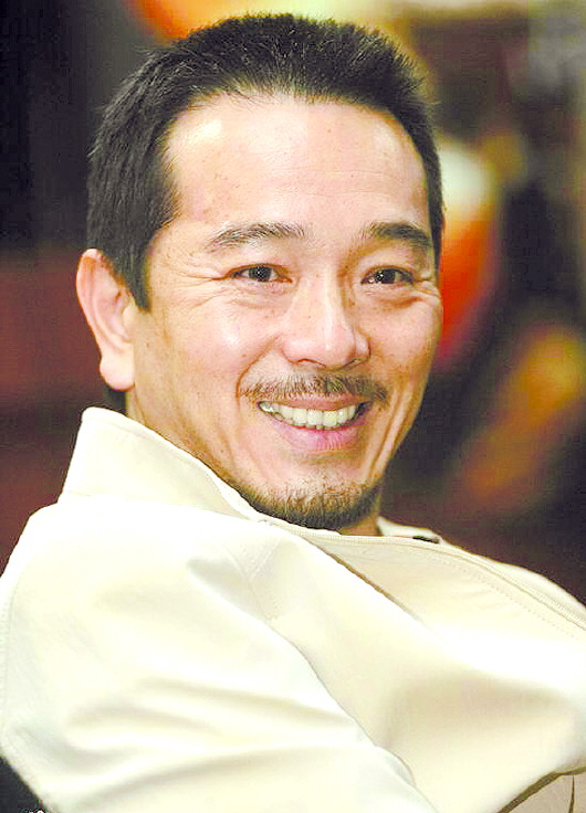 张晨光:学做弯腰的稻穗